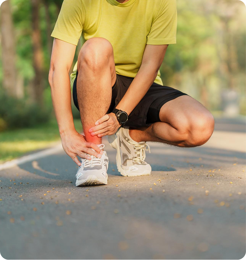 Runner holding a painful ankle with a red highlight