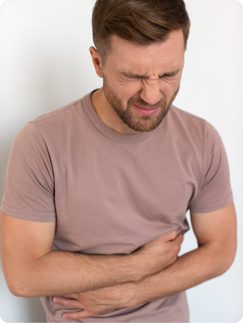 Man holding his abdomen with a pained expression